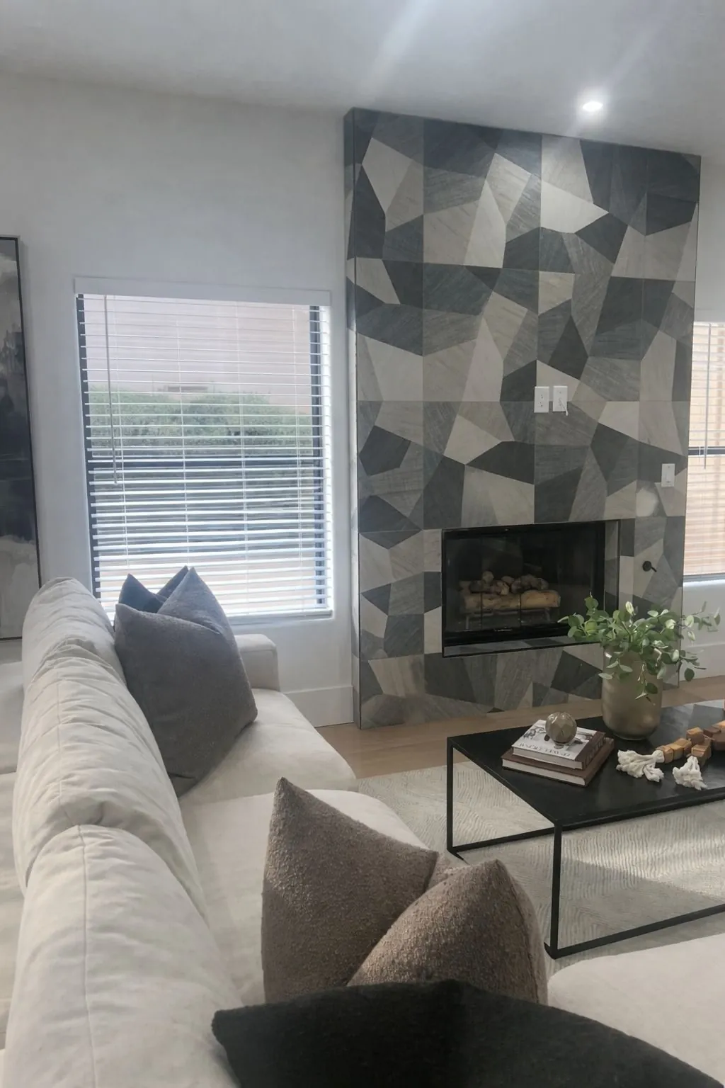 Floor to ceiling geometric tile fireplace accent wall in modern living room Phoenix AZ by RDC Renovation