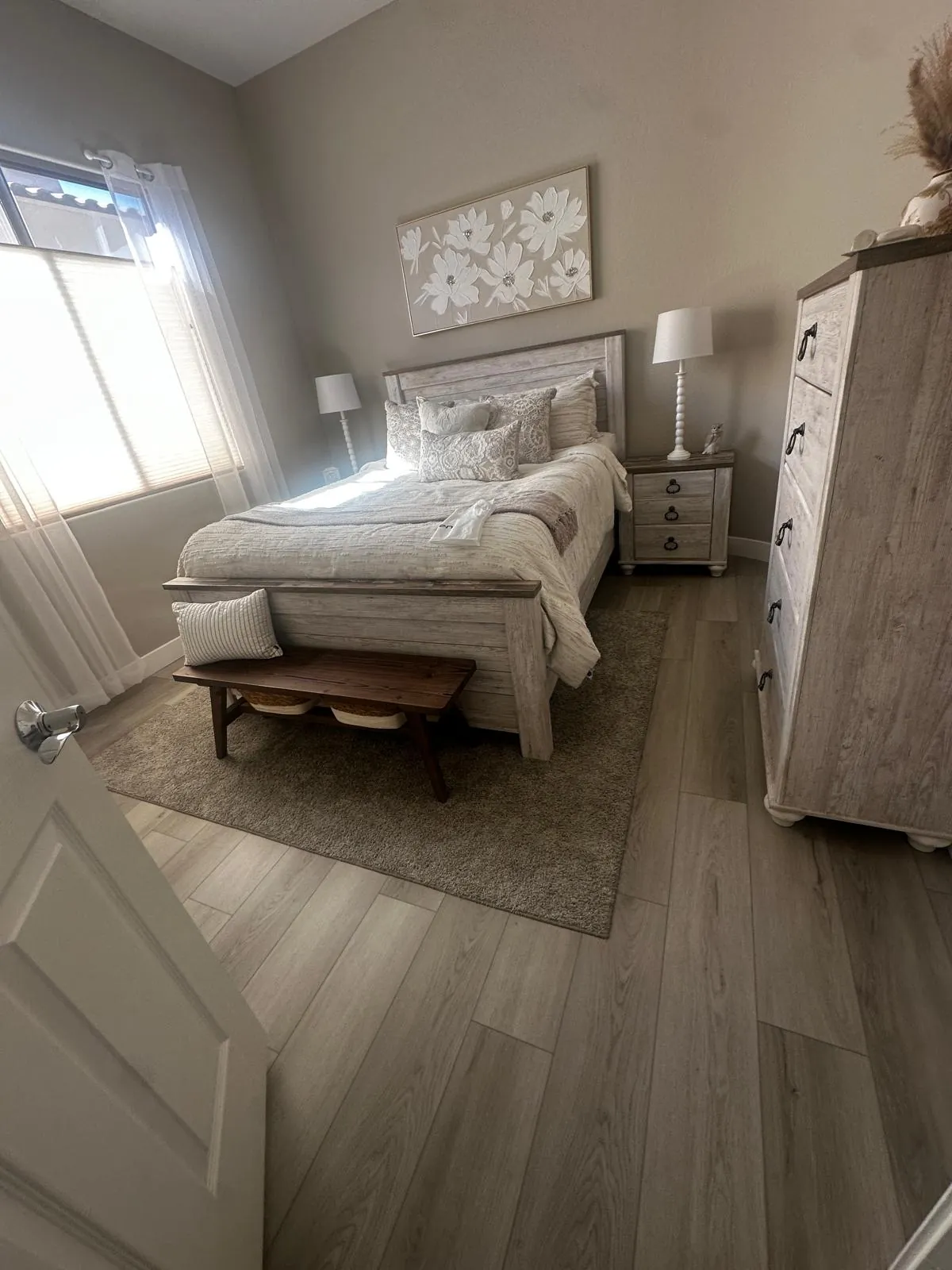 Gray wood-look LVP flooring in a bedroom of a Mesa AZ home, installed by RDC Renovation