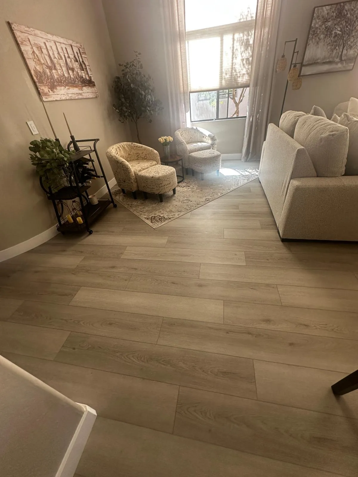 Gray wood-look LVP flooring in a family room of a Mesa AZ home, installed by RDC Renovation