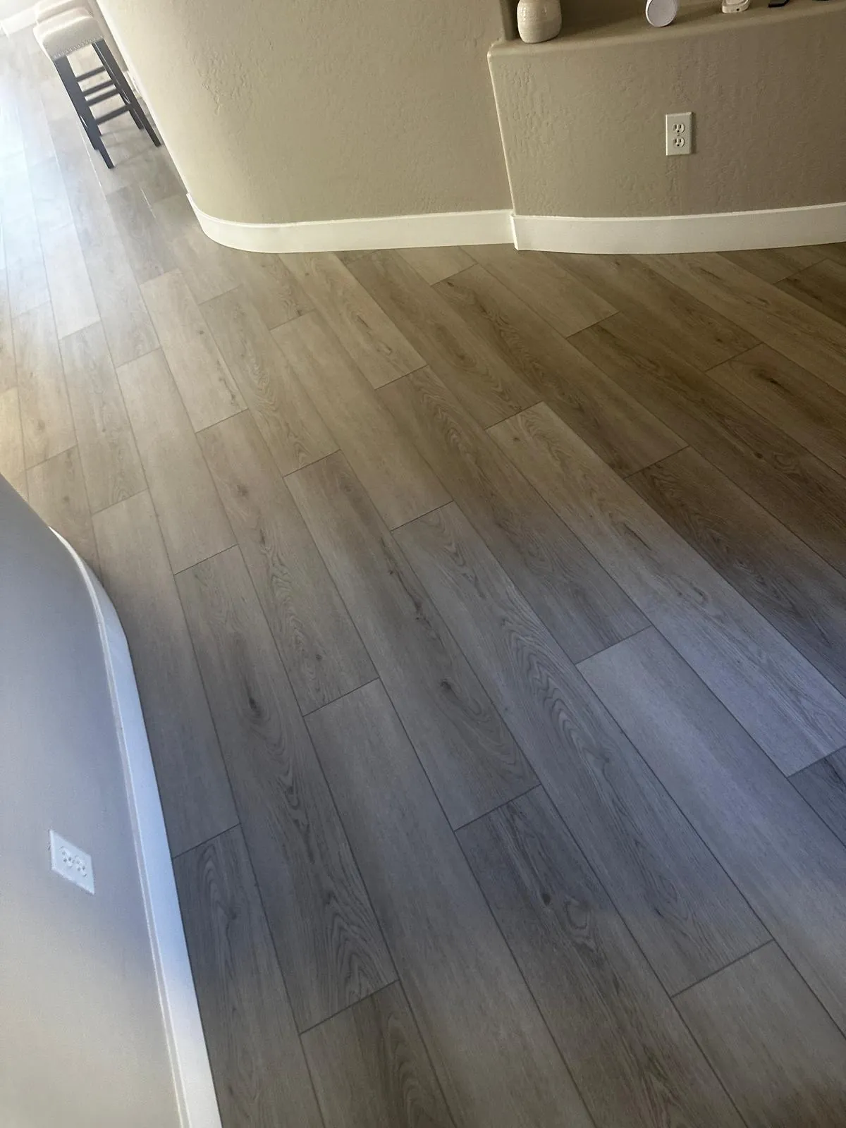 Gray wood-look luxury vinyl plank down a hallway in a Mesa, AZ home, installed by RDC Renovation