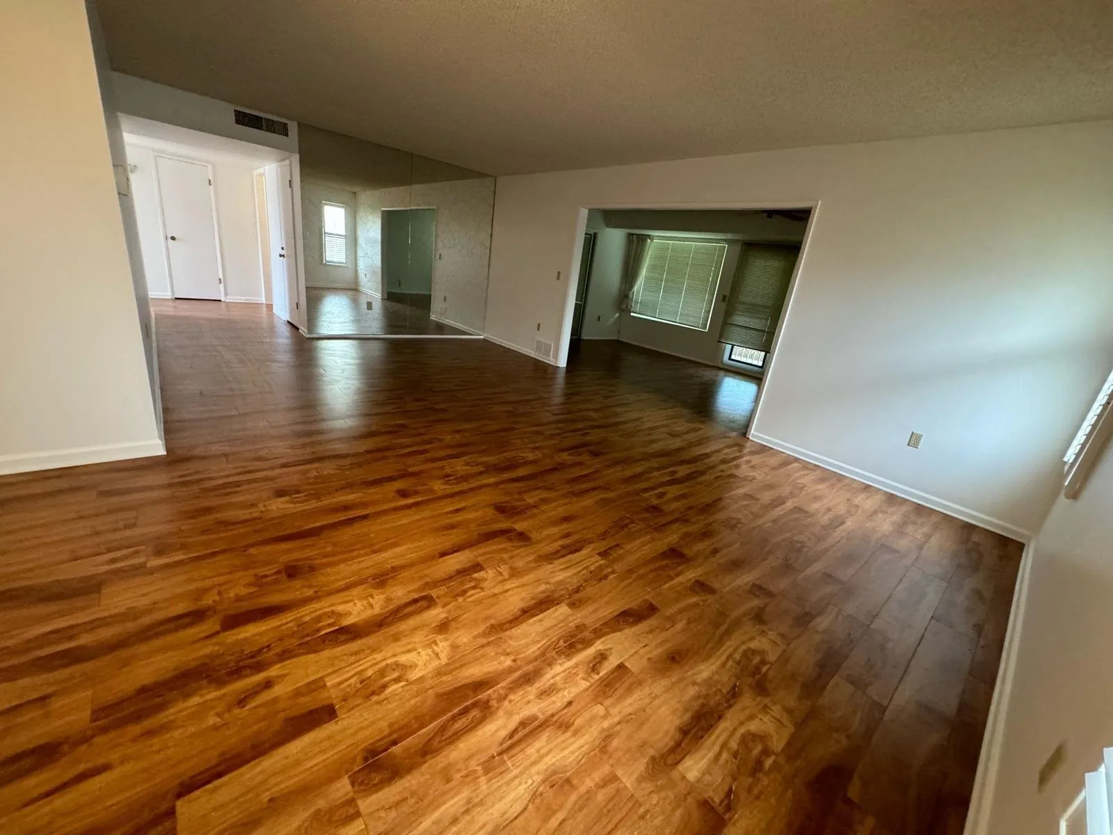 Hardwood engineered flooring installation in large open living room Phoenix AZ