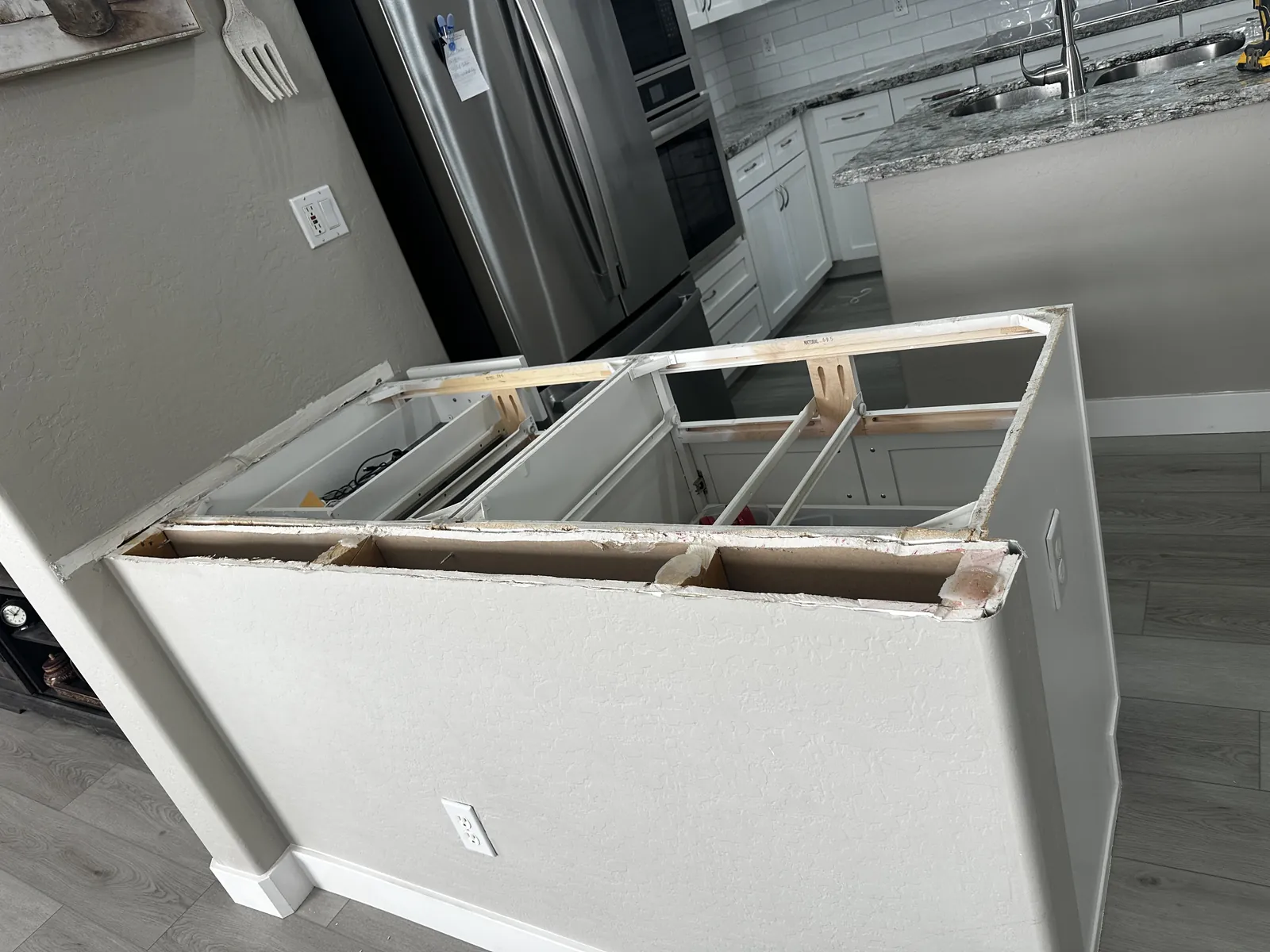 Bare island cabinet frame after the old granite top came off in a Mesa, AZ kitchen, countertop replacement by RDC