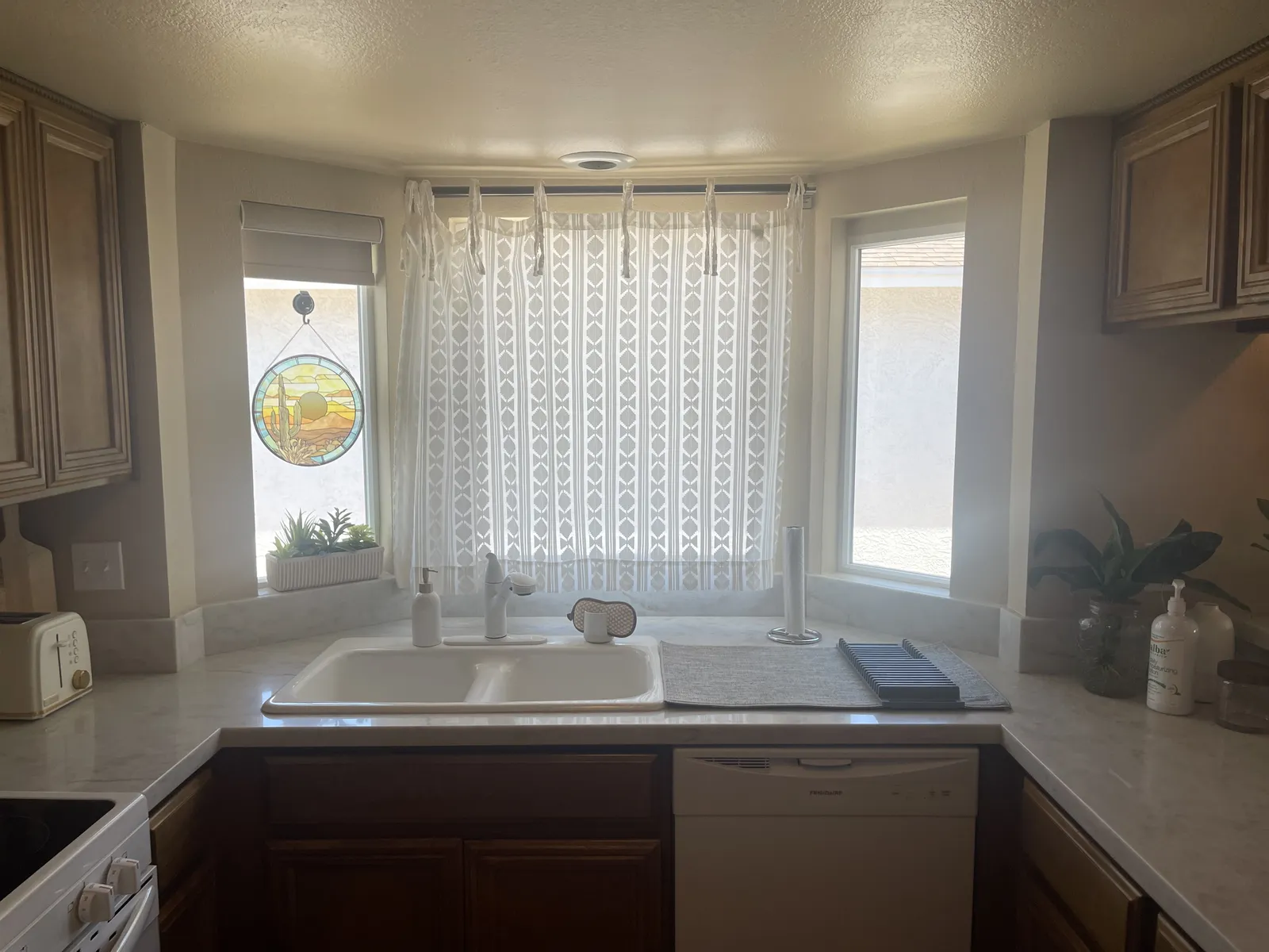 Kitchen remodel with bay window and new stone countertops in Phoenix AZ by RDC Renovation