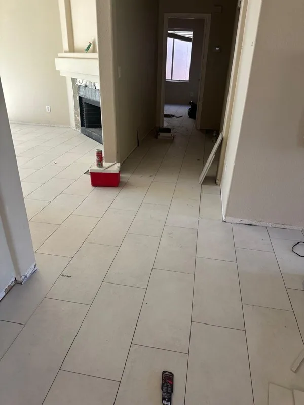 Large-format tile being installed in a hallway by RDC Renovation in a Scottsdale, AZ home