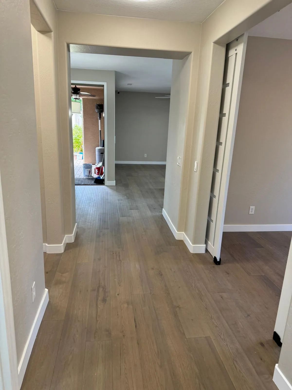 LVP flooring through a hallway and archway installed by RDC Renovation, serving Tempe AZ
