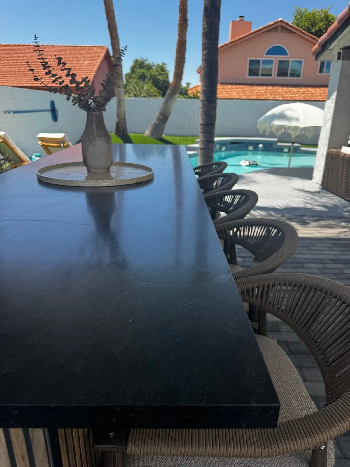 Black granite outdoor bar countertop with poolside seating Phoenix AZ by RDC Renovation