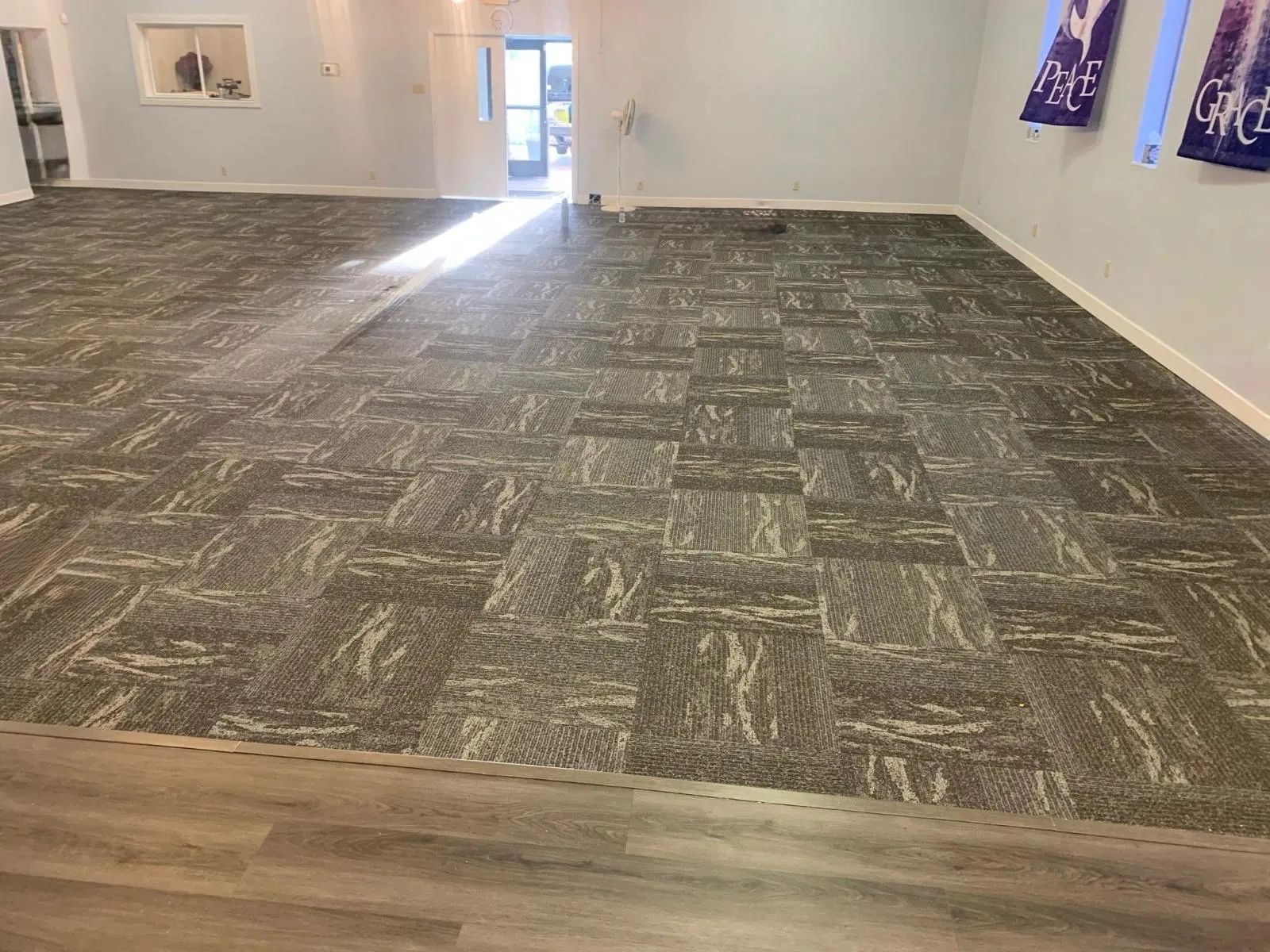 Patterned commercial carpet tile flooring installed across a large room by RDC Renovation in Phoenix AZ