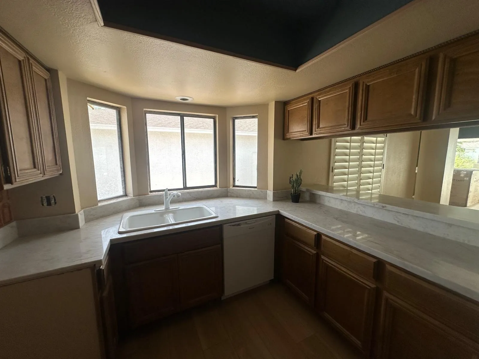 New marble look quartz countertop installed in kitchen with bay window Phoenix AZ