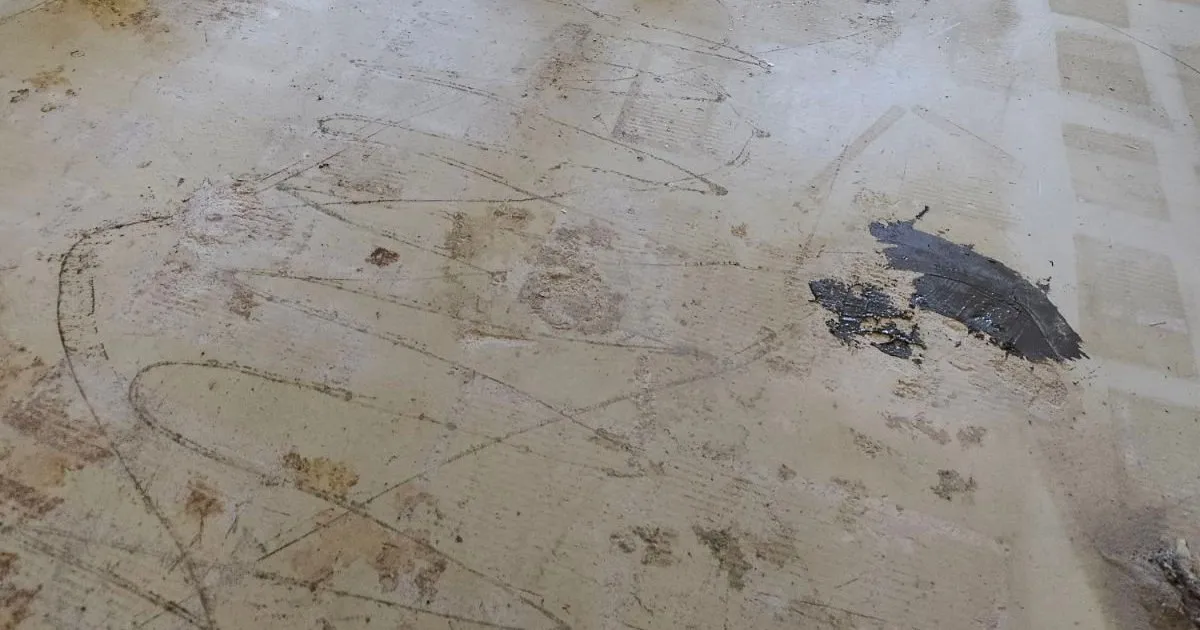 Low spots in a concrete slab patched by RDC Renovation after old tile removal, serving Phoenix, AZ