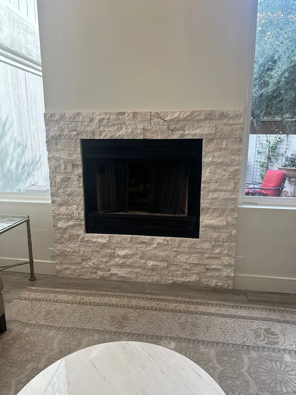 Natural stacked stone tile fireplace surround in living room Phoenix AZ