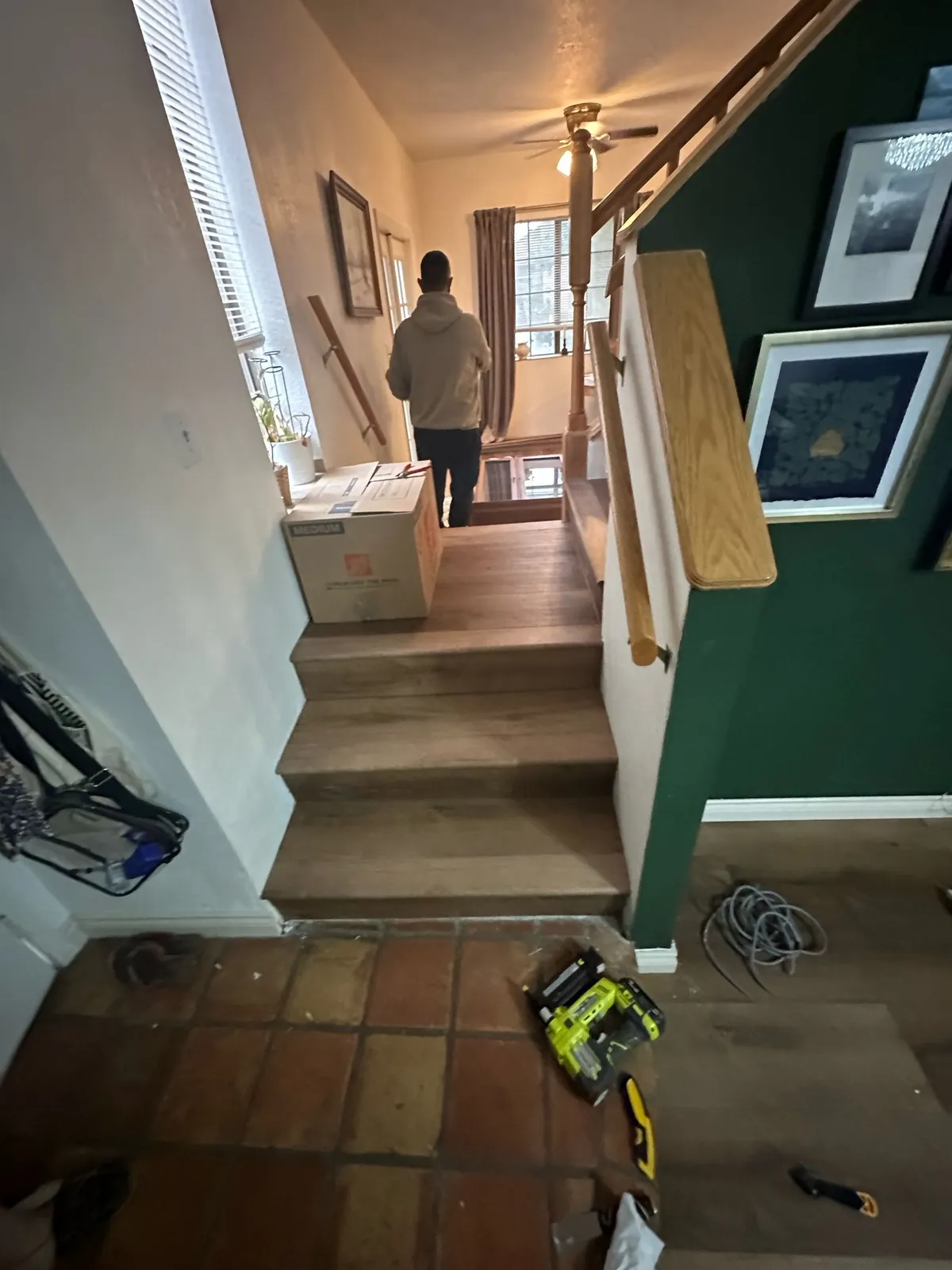 Staircase flooring installation in progress with new treads being fitted by RDC Renovation in Phoenix AZ