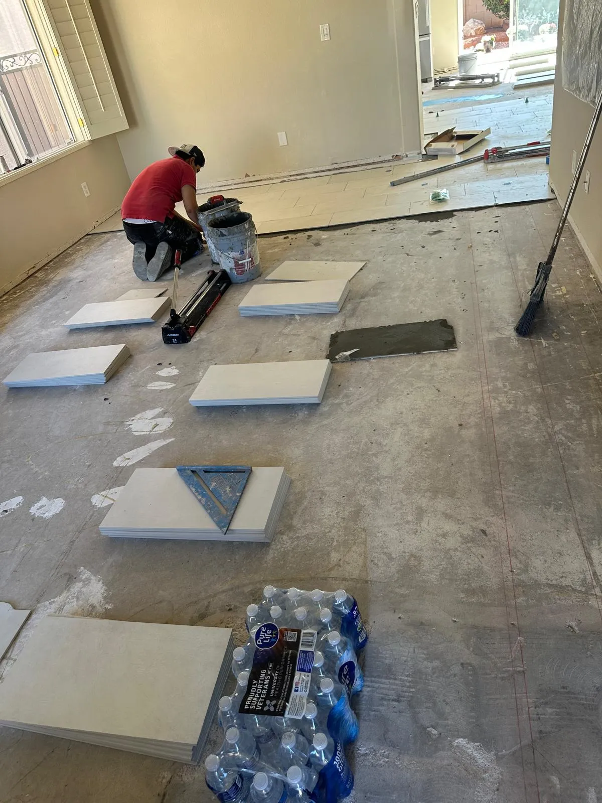 Tile installation in progress on a bathroom floor by RDC Renovation in Phoenix AZ