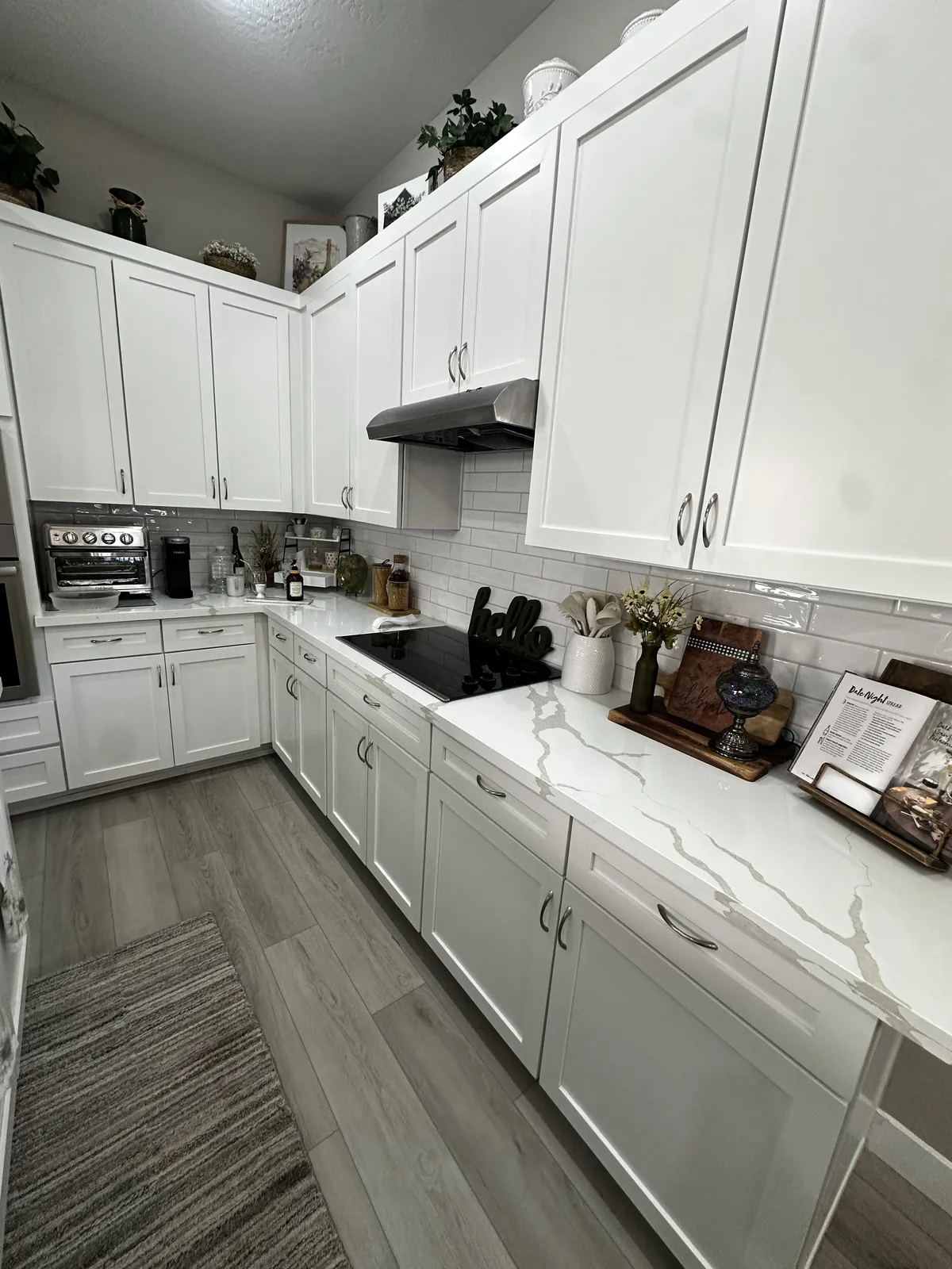White quartz with gray veining on the same white cabinets in a Mesa, AZ kitchen, installed by RDC Renovation
