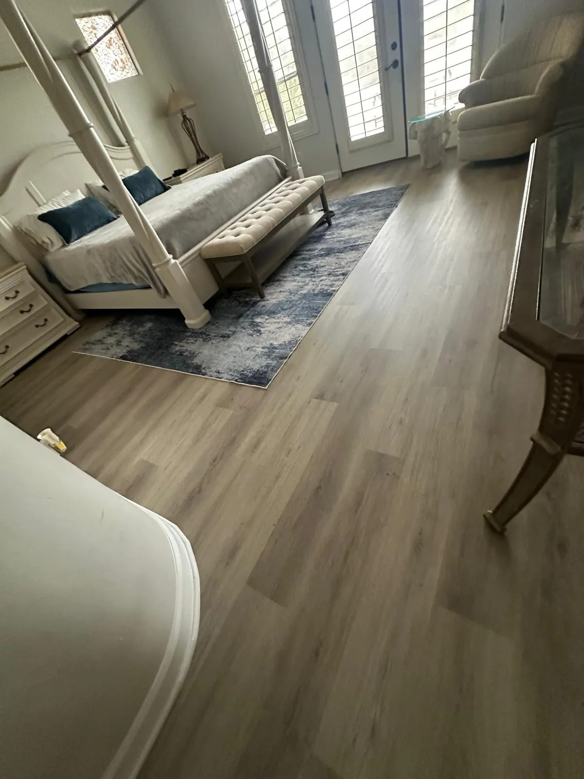 Wide plank LVP flooring in a primary bedroom installed by RDC Renovation, serving Anthem AZ