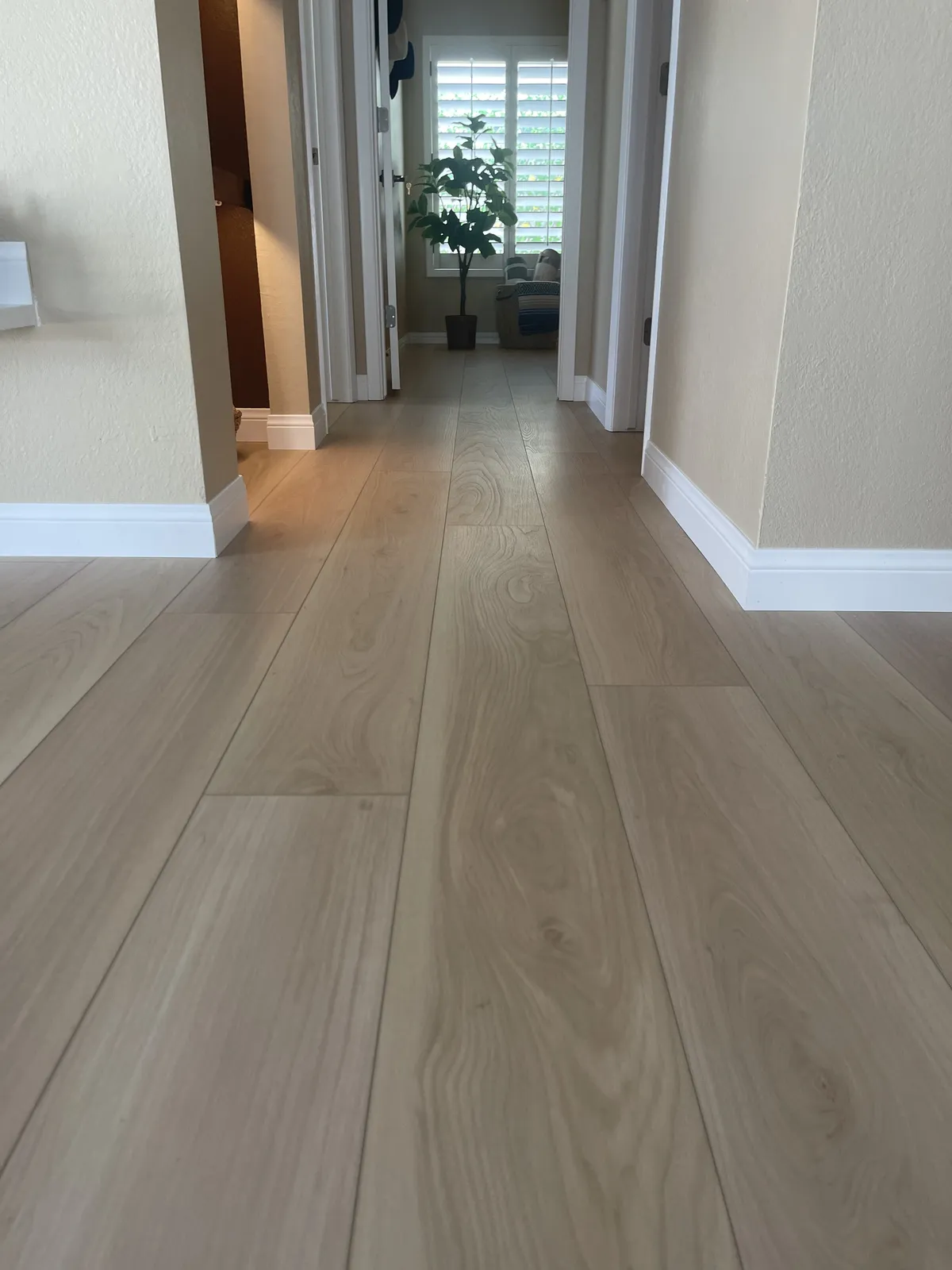 Wide plank white oak look LVP flooring hallway detail in a Phoenix AZ full home remodel by RDC Renovation