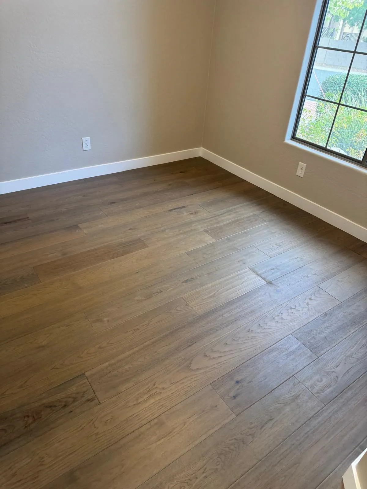 Wood-look plank flooring in a bedroom installed by RDC Renovation, serving Buckeye AZ